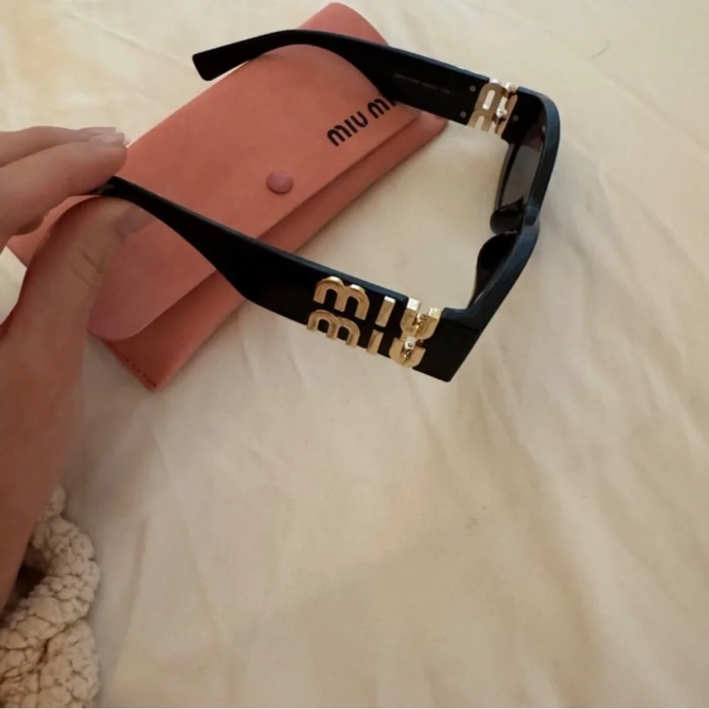Miu Miu Glossy Black Cat-Eye Sunglasses with Pink Case